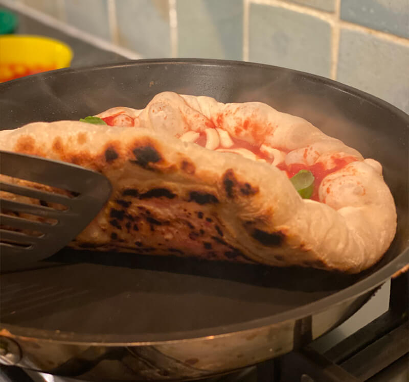 heating pizza in frying pan